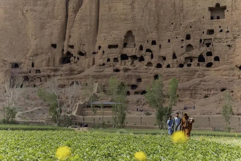 Residents-of-Bamiyan-Afghanistan-go-about-their-daily-lives-through-farming-on-June-8-2025-with-the-niche-of-the-38-metre-Eastern-Buddhadestroyed-by-the-Taliban-in-2001-after-nearly-1-500-yearsoverlooking-the-valley-MIDDLEEASTIMAGES-1