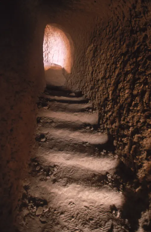 A-passageway-carved-into-the-cliff-near-where-one-of-the-famous-Buddhas-of-Bamiyan-once-stood-leads-to-a-view-over-the-destroyed-Buddha-Bamiyan-August-29-2002-The-Buddhas-which-dated-back-to-the-3rd-century-were-blown-up-by-the-Taliban-in-2001-Bamiyan-Valley-is-located-in-the-Hazarajat-at-the-edge-of-the-Koh-i-Baba-range-the-end-of-the-Hindu-Kush-Bamiyan-was-a-prosperous-Buddhist-kingdom-on-the-Silk-Road-until-the-10th-century-when-the-region-was-converted-to-Islam-in-the-12th-century-it-was-destroyed-by-Ghengis-Khan-but-the-Buddhas-had-survived-Most-of-the-people-of-this-region-are-of-the-Hazara-tribe-and-are-Shi-a-Moslems-who-have-been-persecuted-for-centuries-by-many-of-the-Pashtun-rulers-of-Afghanistan-who-are-from-the-Sunni-sect