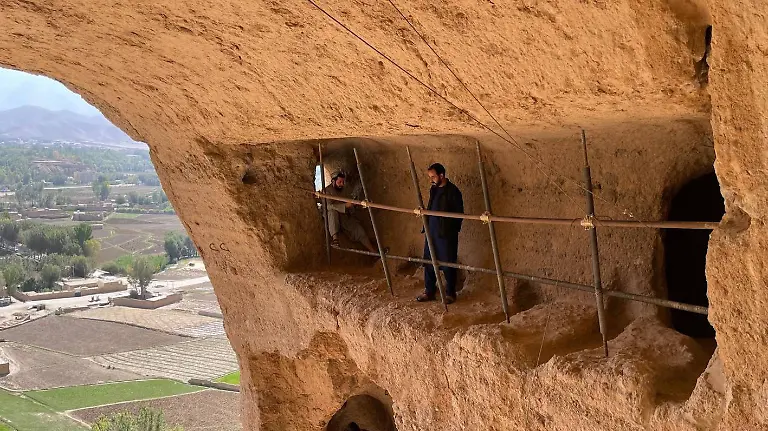 Archaeological-remains-of-the-Bamian-Valley-BAMYAN-AFGHANISTAN-OCTOBER-1-A-view-of-Bamian-Valley-in-Bamyan-Afghanistan-on-October-1-2021-In-the-valley-at-the-end-of-the-10th-century-AD-there-was-a-Buddhist-culture-in-which-several-thousand-Buddhist-monks-lived-in-caves-carved-into-the-mountain-The-55-and-38-meters-high-standing-Buddha-statues-are-two-of-the-best-known-monuments-left-from-the-Buddhists-which-were-then-destroyed-by-the-Taliban-in-2001-The-historical-statues-continue-to-be-a-frequent-destination-for-local-tourists-despite-the-unfinished-restoration-work-Bamian-Afghanistan-Editorial-use-only-Please-get-in-touch-for-any-other-usage