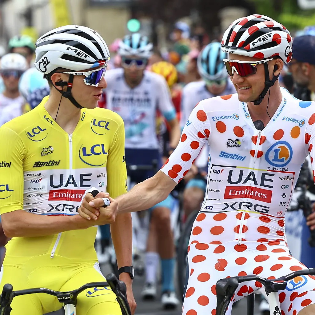 Slovenian-Tadej-Pogacar-of-UAE-Team-Emirates-and-Belgian-Tim-Wellens-of-UAE-Team-Emirates-pictured-at-the-start-of-stage-10-of-the-2025-Tour-de-France-cycling-from-Ennezat-to-Le-Mont-Dore-Puy-de-Sancy-169-km-on-Monday-14-July-2025-in-France-The-112th-edition-of-the-Tour-de-France-starts-on-Saturday-5-July-in-Lille-France-and-will-finish-in-Paris-France-on-the-27th-of-July