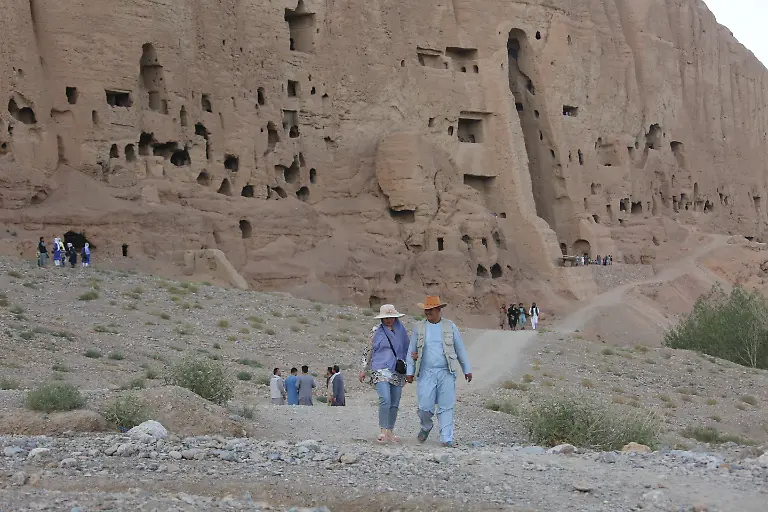 220718-BAMIYAN-July-18-2022-Xinhua-Tourists-visit-the-site-of-the-giant-Buddha-ruins-in-Bamiyan-province-Afghanistan-July-10-2022-Once-a-popular-destination-for-tourists-Afghanistan-s-central-Bamiyan-province-has-been-gradually-recovering-from-the-war-aftermath-to-attract-sightseers-but-the-scarcity-of-accommodations-has-become-a-new-problem