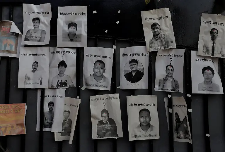 Portraits-of-people-who-died-during-youth-led-protests-that-toppled-Nepal-s-prime-minister-and-prompted-elections-set-for-March-5-2026-are-pasted-on-the-gate-of-the-Parliament-building-which-was-set-on-fire-by-protesters-in-Kathmandu-Nepal-February-23-2026-77-people-were-killed-in-two-days-of-protests-that-later-forced-the-resignation-of-then-Prime-Minister-K-P-Sharma-Oli-and-shook-up-Nepal-s-broken-political-system-A-state-appointed-commission-charged-with-conducting-an-investigation-into-the-protests-including-the-use-of-live-ammunition-against-young-demonstrators-has-received-three-extensions-to-complete-the-probe-Its-final-findings-are-expected-to-be-released-after-the-general-election-REUTERS-Navesh-Chitrakar-SEARCH-CHITRAKAR-NEPAL-PROTESTER-FAMILIES-FOR-THIS-STORY-SEARCH-WIDER-IMAGE-FOR-ALL-STORIES