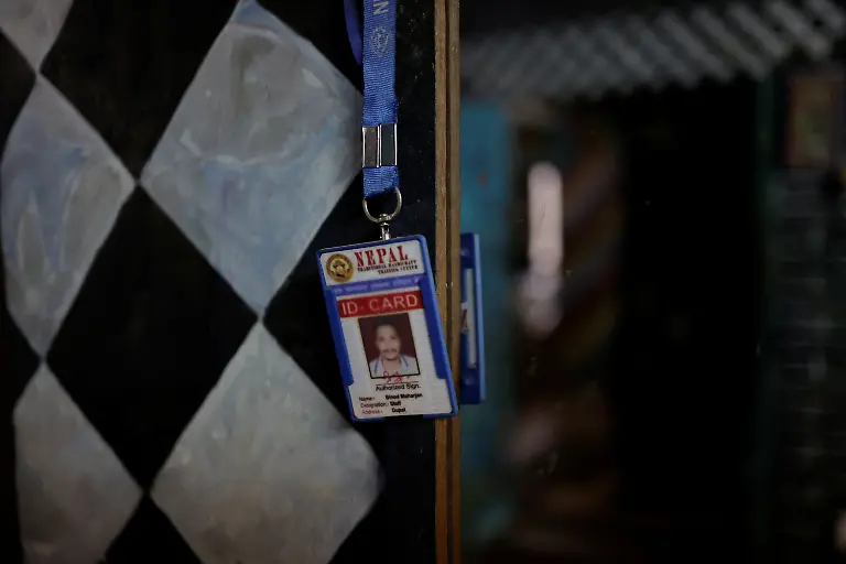 An-identity-card-belonging-to-Binod-Maharjan-34-who-was-shot-dead-during-youth-led-protests-that-toppled-Nepal-s-prime-minister-and-prompted-elections-set-for-March-5-2026-hangs-next-to-a-mirror-inside-the-room-of-his-mother-Lata-Maya-Maharjan-75-in-Lalitpur-Nepal-February-20-2026-After-feeding-pigeons-on-the-terrace-like-he-did-most-mornings-Binod-abruptly-left-home-on-September-8-leaving-his-breakfast-of-rice-and-lentils-The-family-only-discovered-he-had-joined-the-swelling-protests-after-Binod-s-elder-brother-received-a-phone-call-from-one-of-his-sibling-s-childhood-friends-and-rushed-to-Kathmandu-s-Everest-Hospital-My-son-said-he-would-return-home-and-eat-the-meal-he-had-left-behind-said-Lata-Maya-He-never-came-back-REUTERS-Navesh-Chitrakar-SEARCH-CHITRAKAR-NEPAL-PROTESTER-FAMILIES-FOR-THIS-STORY-SEARCH-WIDER-IMAGE-FOR-ALL-STORIES