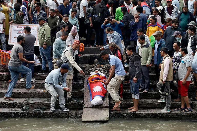 SENSITIVE-MATERIAL-THIS-IMAGE-MAY-OFFEND-OR-DISTURB-Family-members-perform-final-rites-near-the-body-of-Rashik-Khatiwada-23-who-was-shot-dead-during-youth-led-protests-that-toppled-Nepal-s-prime-minister-on-the-premises-of-the-Pashupatinath-temple-along-the-bank-of-the-Bagmati-River-in-Kathmandu-Nepal-September-16-2025-After-years-of-being-largely-indifferent-to-politics-Khatiwada-s-mother-Rachana-joined-the-Rastriya-Swatantra-Party-stating-her-decision-was-driven-by-a-motivation-to-seek-justice-for-her-son-and-the-families-of-others-killed-in-the-protests-What-have-past-leaders-done-for-this-country-over-the-last-three-decades-They-accumulated-wealth-for-themselves-and-placed-their-own-people-in-positions-of-power-to-benefit-from-it-Rachana-said-What-did-they-truly-do-for-the-nation-REUTERS-Navesh-Chitrakar-SEARCH-CHITRAKAR-NEPAL-PROTESTER-FAMILIES-FOR-THIS-STORY-SEARCH-WIDER-IMAGE-FOR-ALL-STORIES