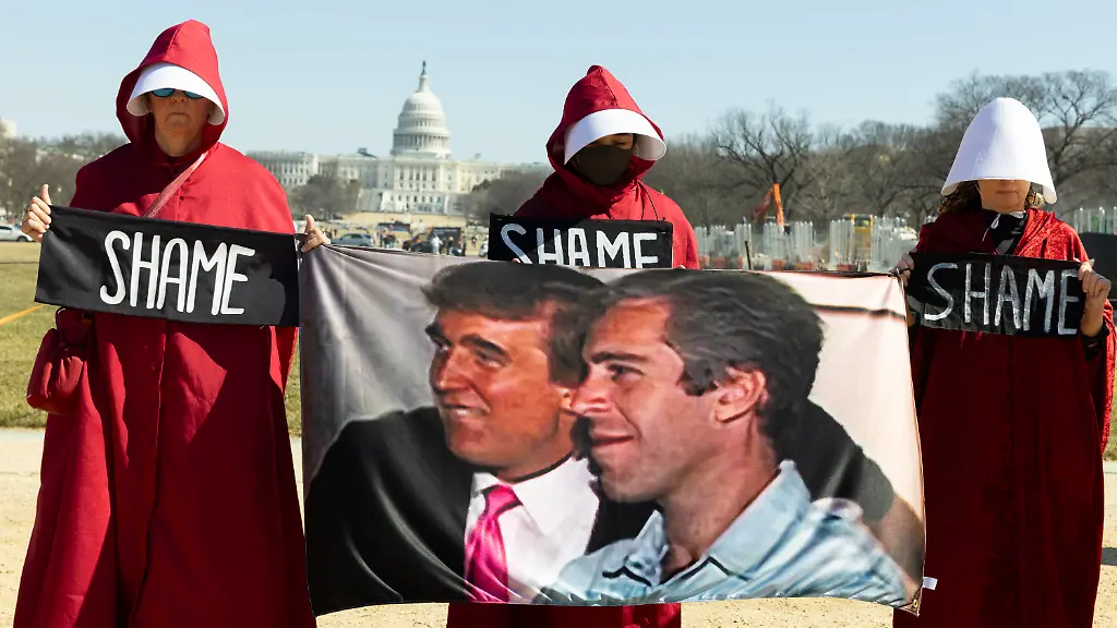 Demonstrators-dressed-as-handmaids-from-The-Handmaid-s-Tale-hold-a-Trump-Epstein-sign-during-the-March-4-Democracy-rally-on-the-National-Mall-in-Washington-DC-on-February-28-2026-On-this-day-US-President-Donald-Trump-announces-that-the-United-States-and-Israel-launch-major-military-strikes-on-Iran-that-kill-Iran-s-Supreme-Leader-Ayatollah-Ali-Khamenei