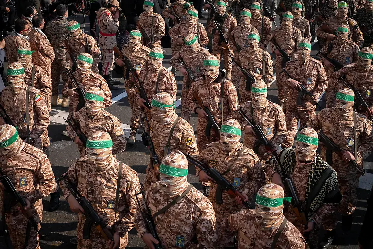 Islamic-Revolutionary-Guard-Corps-armed-personnel-wear-masks-and-participate-in-a-military-rally-in-downtown-Tehran-Iran-on-January-10-2025-The-IRGC-spokesperson-says-on-Monday-January-6-that-the-military-rally-named-Rahian-e-Quds-Passengers-of-Al-Aqsa-includes-110-000-IRGC-members