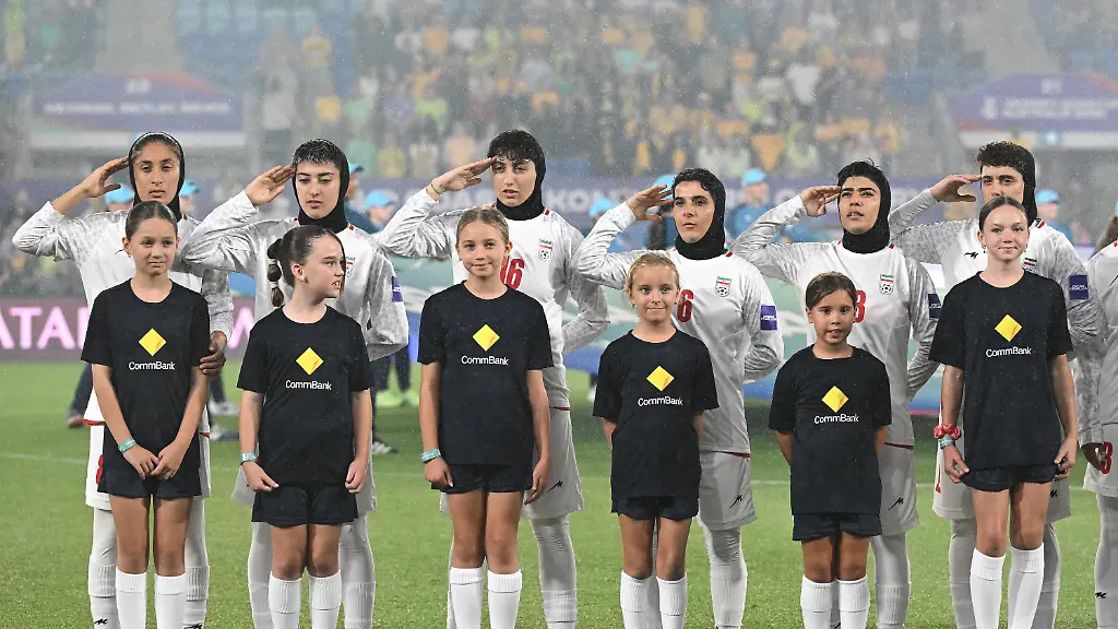 Iran-players-react-during-their-national-anthem-ahead-of-the-Women-s-Asia-Cup-soccer-match-between-Australia-and-Iran-in-Robina-Australia-Thursday-March-5-2026