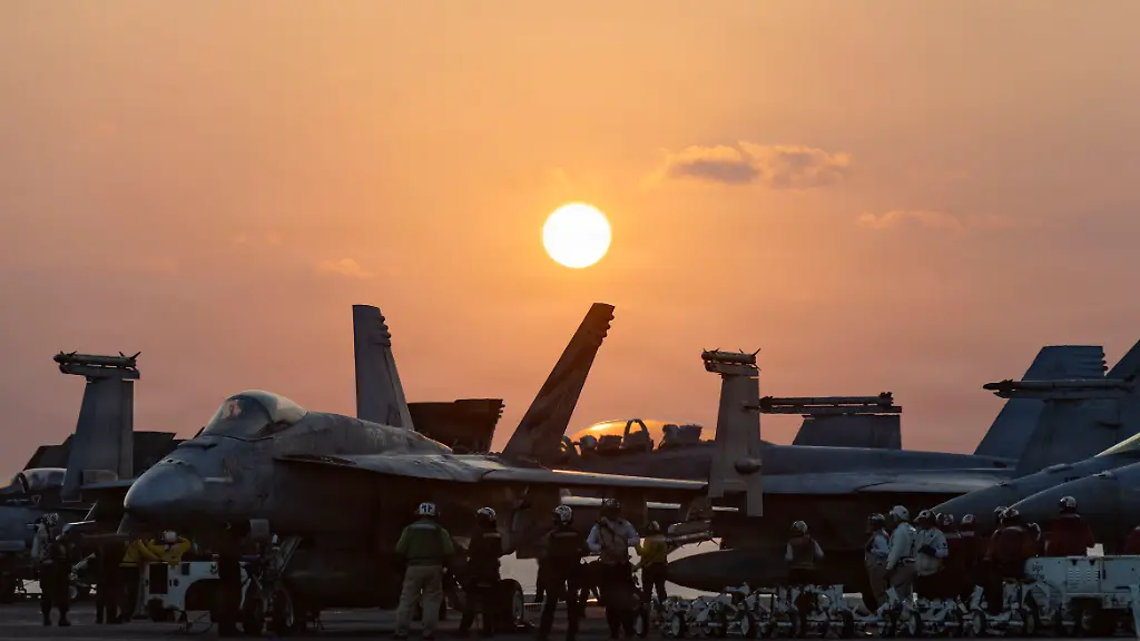 March-6-2026-Undisclosed-Location-United-States-The-sunsets-over-U-S-Navy-F-A-18-fighter-aircraft-stacked-on-the-flight-deck-of-the-Nimitz-class-aircraft-carrier-USS-Abraham-Lincoln-during-Operation-Epic-Fury-March-4-2026-from-an-undisclosed-location-The-United-States-and-Israel-launched-joint-strikes-on-Iran-Credit-Image-A-Us-Navy-U-S