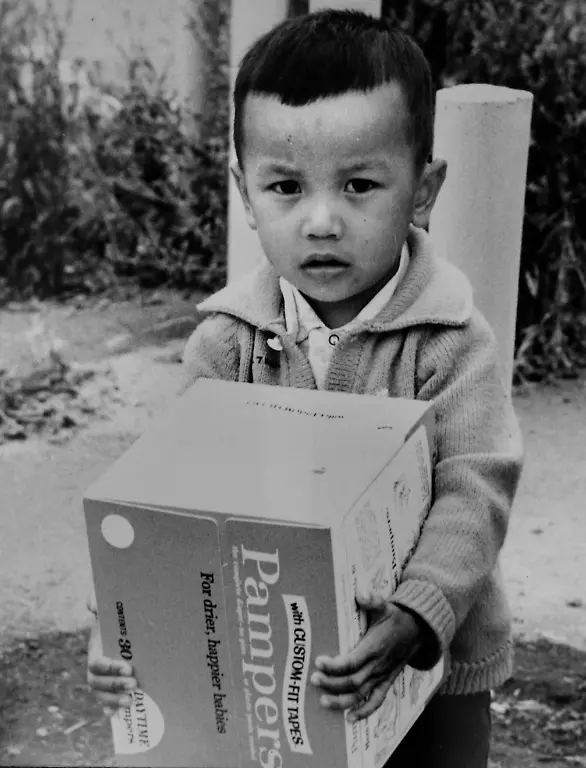 Apr-07-2010-Camp-Pendleton-CA-U-S-CAMP-PENDLETON-PHOTO-May-14-1974-A-boy-in-the-Vietnamese-refugee-camp-at-the-base-s-Camp-Telega-area-holds-a-box-of-Pampers