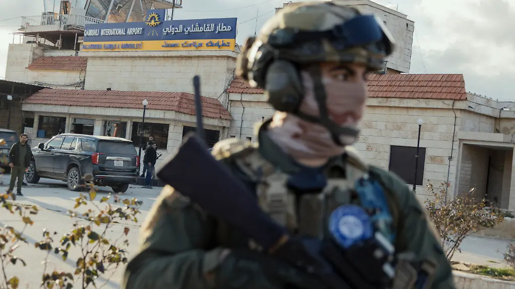 An-armed-member-of-Kurdish-Asayish-forces-stands-guard-near-Qamishli-International-Airport-in-Qamishli-Syria-on-February-8-2026-A-delegation-from-the-Syrian-Interim-Government-entered-the-airport-under-escort-by-Kurdish-Asayish-security-forces-for-a-field-visit-and-talks-with-Kurdish-led-authorities-on-reopening-the-airport-under-joint-management