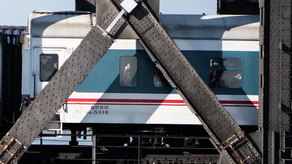 Chinese-tourists-come-back-by-train-after-visiting-North-Korea-in-the-Chinese-border-town-of-Dandong-in-China-s-northeast-Liaoning-province-on-May-31-2018-The-city-of-Dandong-which-is-the-main-crossing-point-into-China-from-North-Korea-hopes-to-have-a-new-economic-pulse-after-Kim-Jong-Un-and-Donald-Trump-set-to-hold-their-historic-summit-in-Singapore