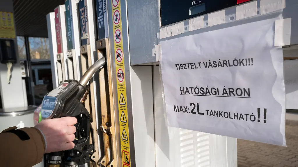 A-view-of-a-sign-on-a-fuel-pump-at-a-petrol-station-reading-Dear-Costumers-You-can-purchase-only-2-liters-of-fuel-at-the-regulated-price-in-Martonvasar-Hungary-Thursday-Dec-1-2022-Drivers-in-Hungary-are-running-into-fuel-shortages-at-filling-stations-as-a-government-imposed-price-cap-on-fuel-squeezes-independent-stations-and-leaves-the-state-energy-company-struggling-to-keep-up-with-demand