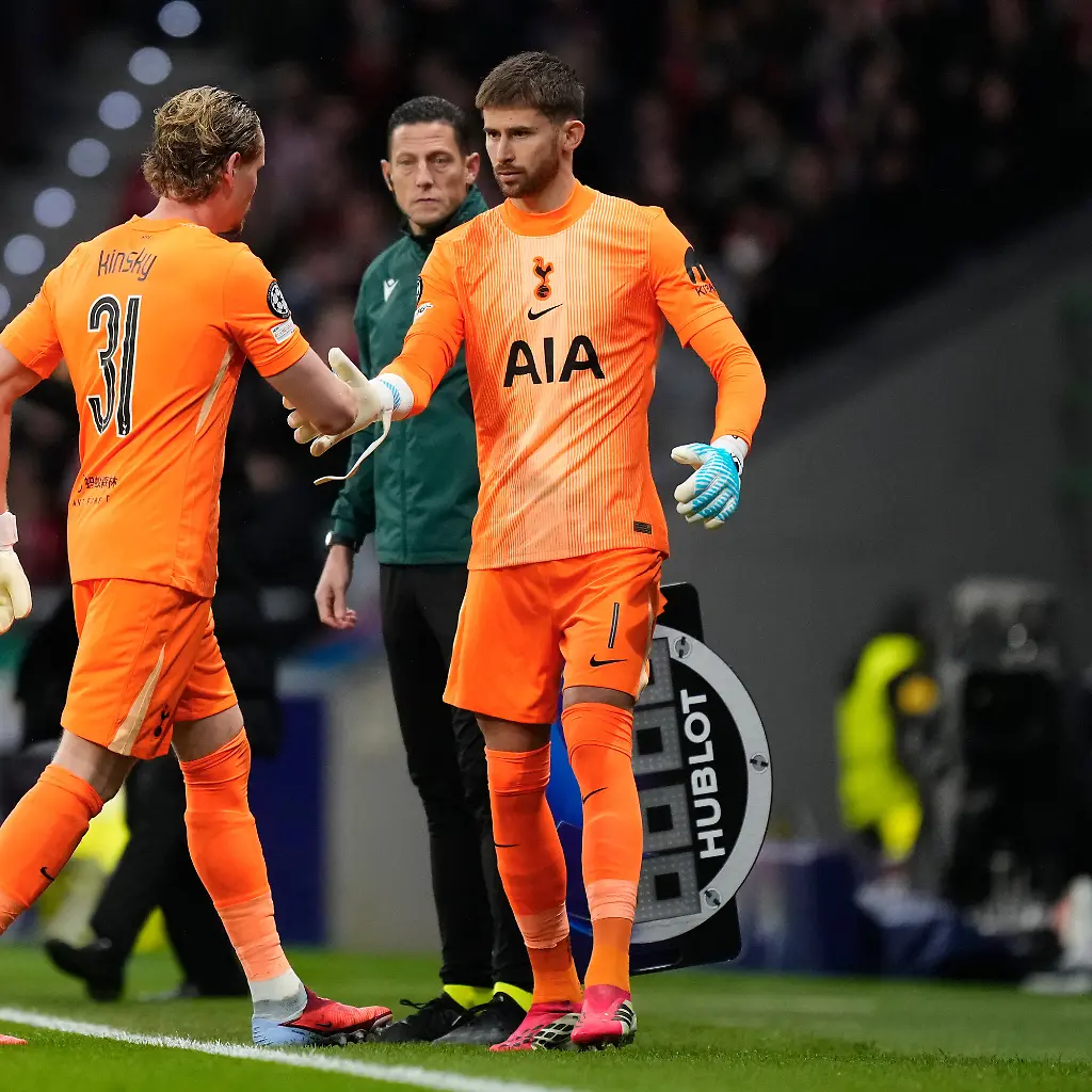 Tottenham-s-goalkeeper-Antonin-Kinsky-left-shakes-hands-with-Tottenham-s-goalkeeper-Guglielmo-Vicario-after-substitution-during-the-first-leg-of-the-Champions-League-round-of-16-soccer-match-between-Atletico-Madrid-and-Tottenham-in-Madrid-Spain-Tuesday-March-10-2026