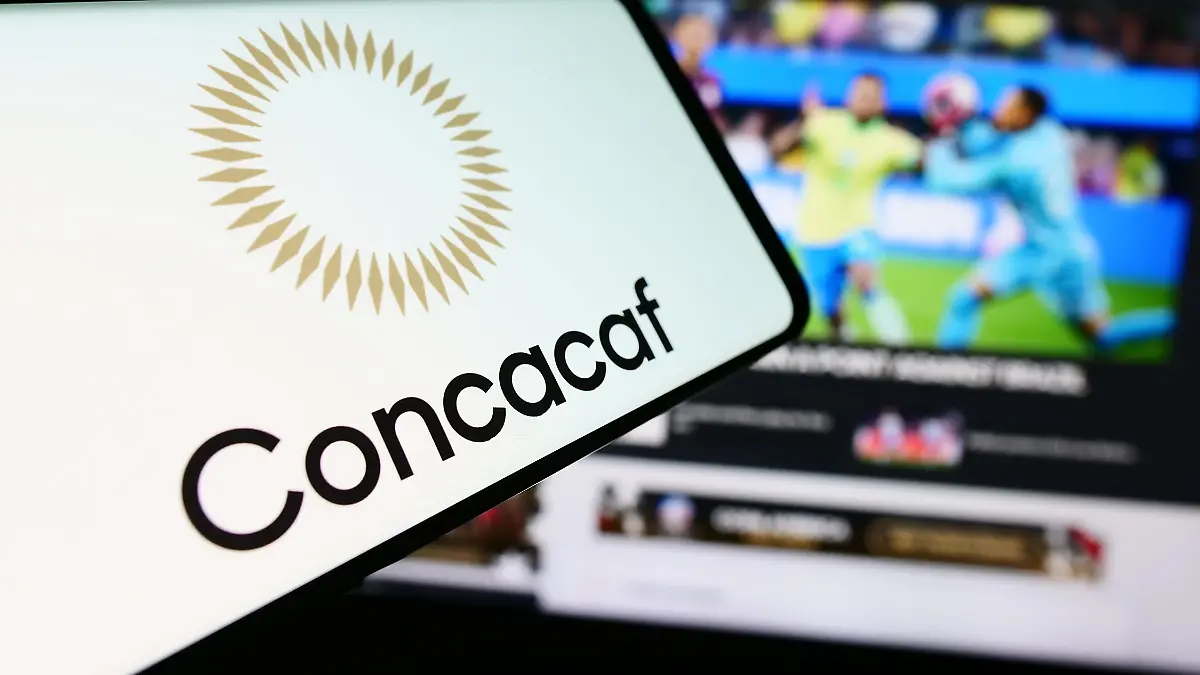 In-this-photo-illustration-a-mobile-phone-with-the-logo-of-football-association-CONCACAF-is-seen-in-front-of-website