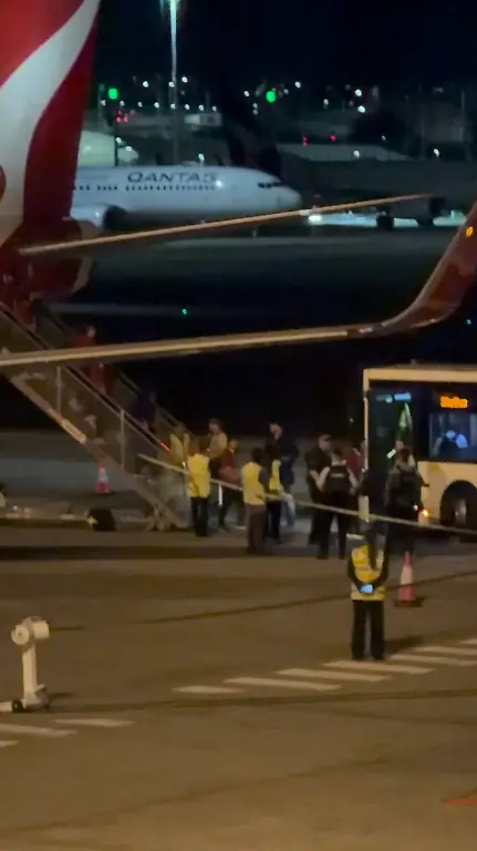 Members-of-the-Iranian-women-s-soccer-team-disembark-a-plane-as-they-arrive-at-Sydney-Airport-in-Sydney-Australia-March-10-2026-in-this-screengrab-obtained-from-a-video-Marcus-Merz-via-REUTERS-THIS-IMAGE-HAS-BEEN-SUPPLIED-BY-A-THIRD-PARTY-MANDATORY-CREDIT-Verification-Lines-Reuters-was-able-to-confirm-the-date-and-the-location-of-the-videos-from-the-original-file-metadata-Interior-design-and-the-stores-matched-the-file-imagery-of-the-airport-Australian-authorities-also-confirmed-on-Tuesday-March-10-that-five-Iranian-players-granted-humanitarian-visas-in-the-country-Local-media-reports-and-corroborating-videos-from-the-airport-showed-the-players-landed-in-Sydney-with-supporters-gathered-in-the-terminal