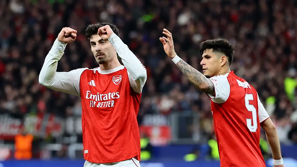 Soccer-Football-UEFA-Champions-League-Round-16-First-Leg-Bayer-Leverkusen-v-Arsenal-BayArena-Leverkusen-Germany-March-11-2026-Arsenal-s-Kai-Havertz-celebrates-scoring-their-first-goal-with-Piero-Hincapie-REUTERS-Wolfgang-Rattay