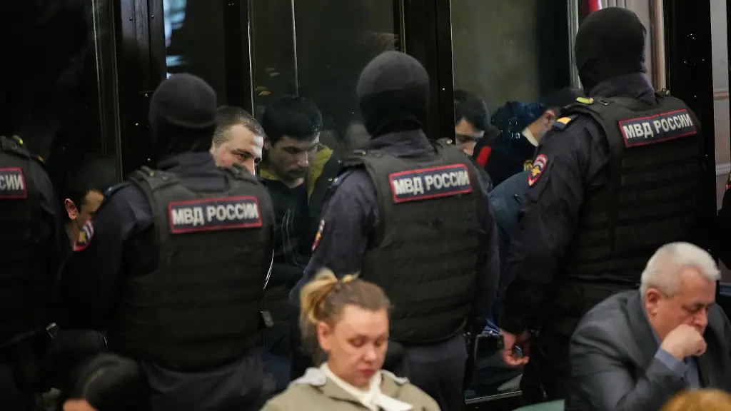 Men-tried-on-the-charges-of-involvement-in-a-terror-attack-at-the-Crocus-City-Hall-in-March-2024-listen-to-the-verdict-in-a-glass-cage-at-the-Second-Western-District-Military-Court-in-Moscow-Russia-Thursday-March-12-2026