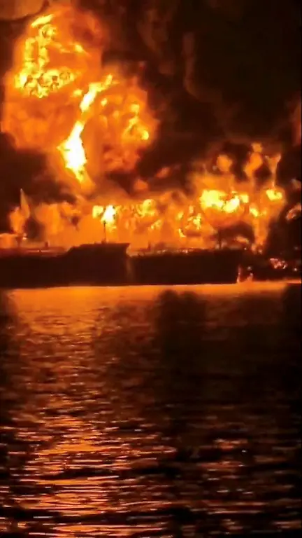 A-ship-burns-after-Iranian-explosive-laden-boats-appear-to-have-attacked-two-fuel-tankers-in-Iraqi-waters-setting-them-ablaze-according-to-port-maritime-security-and-risk-firms-amid-the-U-S-Israeli-conflict-with-Iran-in-this-screengrab-taken-from-a-handout-video-released-March-12-2026-Media-Office-of-Iraqi-Ports-Handout-via-REUTERS-THIS-IMAGE-HAS-BEEN-SUPPLIED-BY-A-THIRD-PARTY-TPX-IMAGES-OF-THE-DAY-VERIFICATION-Identity-of-one-tanker-confirmed-as-Zefyros-by-shape-which-matched-file-imagery-of-the-ship-Exact-date-not-verified-but-no-older-version-of-the-footage-was-found-posted-online-before-March-12-Vessel-tracking-data-puts-the-location-of-the-tankers-Zefyros-and-Safesea-Vishnu-in-Iraqi-territorial-waters-on-March-12-2026-Iraqi-News-Agency-cited-a-statement-from-the-State-Organization-for-Marketing-of-Oil-SOMO-confirming-the-tankers-Safesea-Vishnu-and-Zefyros-were-hit-while-they-were-present-in-the-ship-to-ship-loading-area-within-Iraqi-territorial-waters