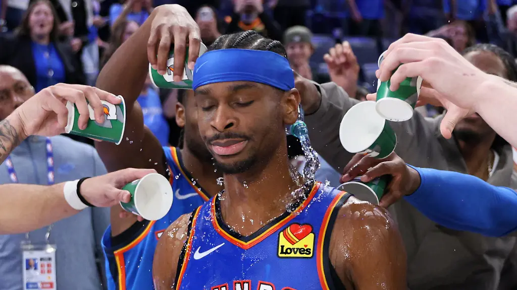 Oklahoma-City-Thunder-players-pour-water-on-Thunder-guard-Shai-Gilgeous-Alexander-after-an-NBA-basketball-game-against-the-Boston-Celtics-Thursday-March-12-2026-in-Oklahoma-City