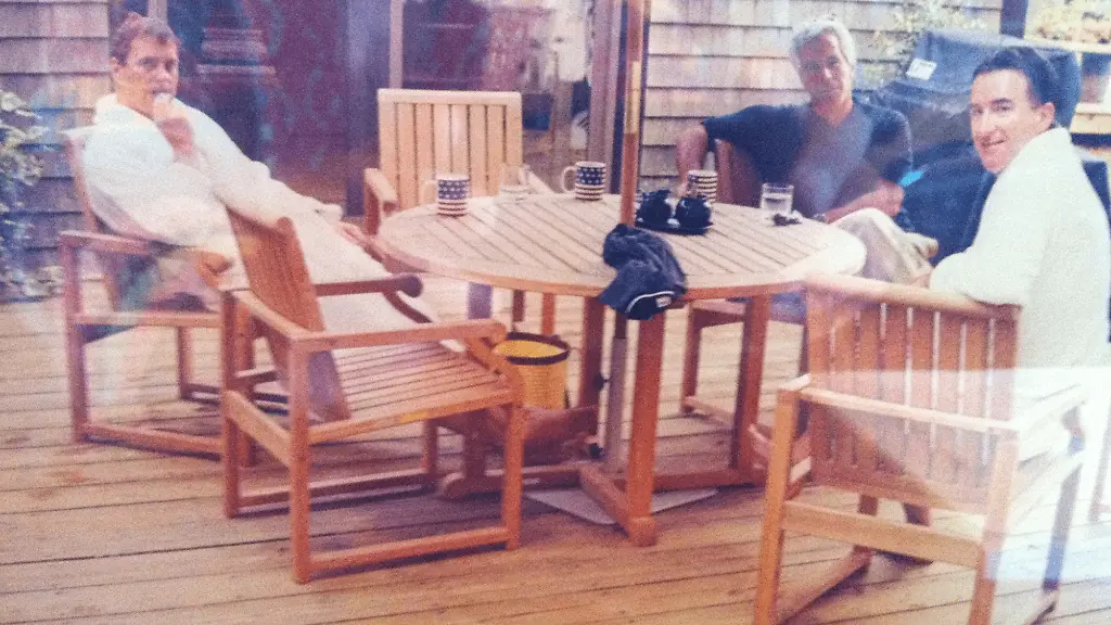 This-undated-photo-in-an-unidentified-location-provided-by-the-US-Department-of-Justice-on-March-13-2026-shows-Andrew-Mountbatten-Windsor-and-Lord-Peter-Mandelson-wearing-bathrobes-seated-alongside-late-financier-and-convicted-sex-offender-Jeffrey-Epstein-Epstein-Files-Transparency-Act-EFTA-passed-by-Congress-and-signed-into-law-by-US-President-Donald-Trump-mandated-the-complete-release-of-the-Epstein-files-by-December-19-2025