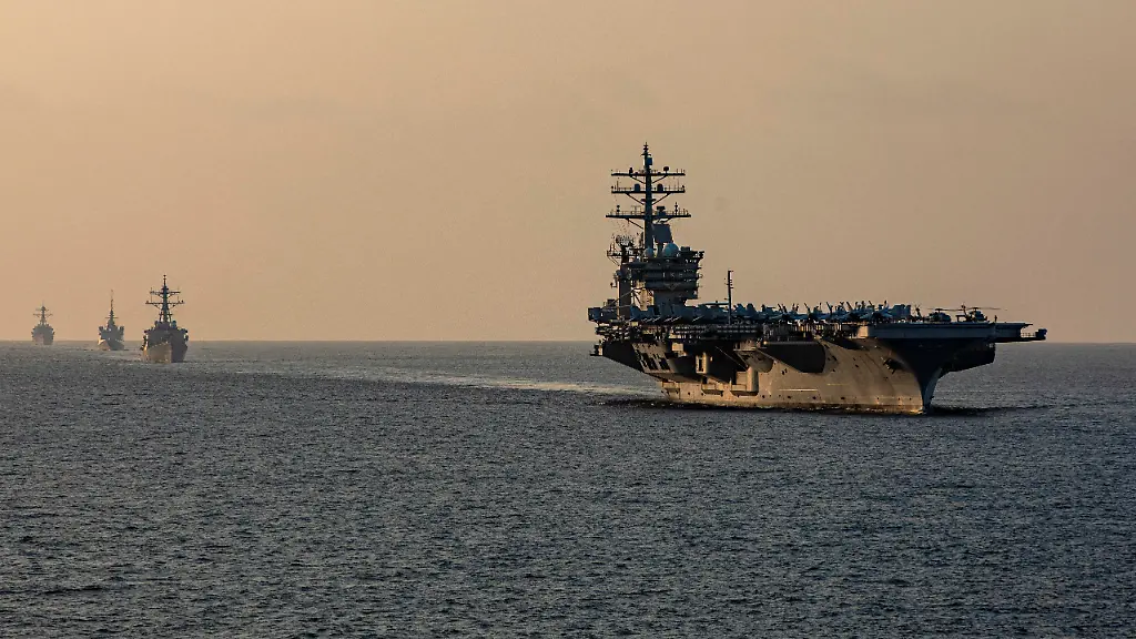 Components-of-the-Dwight-D-Eisenhower-Carrier-Strike-Group-IKECSG-guided-missile-destroyer-USS-Stethem-DDG-63-and-French-Navy-frigate-FS-Languedoc-D-653-transit-the-Strait-of-Hormuz-November-25-2023-U-S-Navy-Mass-Communication-Specialist-2nd-Class-Keith-Nowak-Handout-via-REUTERS