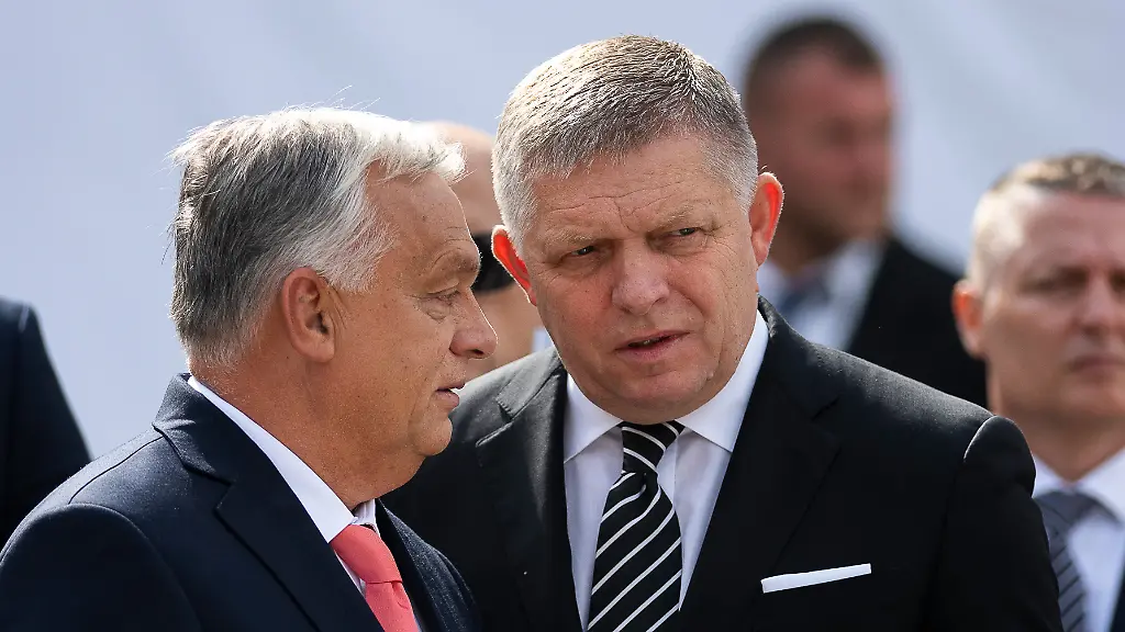 Hungary-s-Prime-Minister-Viktor-Orban-left-and-his-Slovakian-counterpart-Robert-Fico-talk-to-each-other-before-delivering-their-speeches-during-the-130th-anniversary-celebration-of-Maria-Valeria-Bridge-in-Esztergom-Hungary-on-Sunday-Sept-28-2025