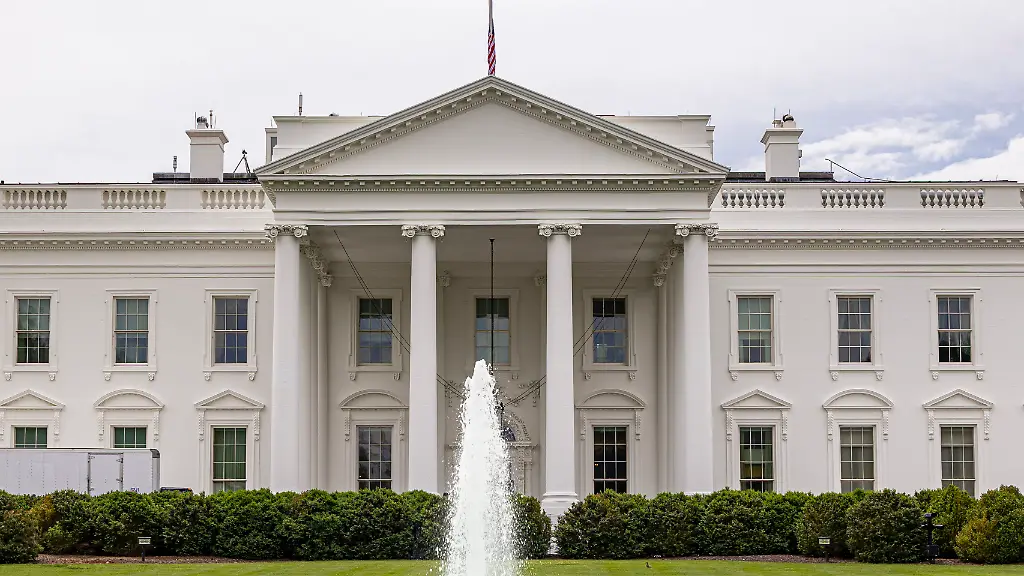 Exterior-view-of-the-Northern-side-of-the-White-House-in-Washington-DC-as-seen-from-Lafayette-Square-park-and-Pennsylvania-Avenue-The-White-House-is-the-official-residence-and-workplace-of-the-president-of-the-United-States-of-America-POTUS-and-has-been-the-residence-of-every-U-S-president-since-John-Adams-in-1800-The-residence-was-designed-by-Irish-born-architect-James-Hoban-in-the-neoclassical-architecture-style-Outside-of-the-the-North-side-is-a-fountain-in-the-lawn-the-executive-residence-northern-facade-is-with-a-columned-portico-Secret-Service-police-with-cars-and-dogs-are-patrolling-and-guarding-the-building-as-many-tourists-visit-the-location-daily-The-American-flag-is-flown-at-half-staff-honoring-the-victims-of-the-tragedy-in-Allen-Texas-and-respect-for-the-victims-of-violence