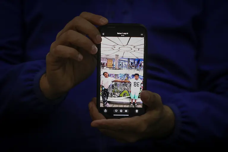 Hamid-Shirmohammadzadeh-35-who-arrived-in-Turkey-from-Iran-holds-a-mobile-phone-displaying-a-picture-of-his-children-at-the-hotel-where-he-is-staying-in-Van-province-Turkey-March-5-2026-He-had-been-building-a-life-in-Tokyo-working-for-an-import-export-company-When-his-work-visa-expired-in-February-he-returned-to-Tehran-where-his-wife-and-two-children-aged-nine-and-ten-had-been-living-They-are-now-waiting-near-the-border-in-Iran-while-he-tries-to-secure-visas-from-Japanese-authorities-so-they-can-join-him-abroad-REUTERS-Dilara-Senkaya-SEARCH-SENKAYA-IRAN-CRISIS-TURKEY-BORDER-FOR-THIS-STORY-SEARCH-WIDER-IMAGE-FOR-ALL-STORIES