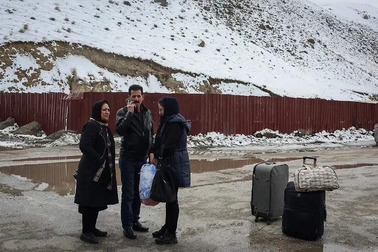 Yasna-63-from-Iran-stands-with-her-husband-and-daughter-after-crossing-into-Turkey-in-Van-province-Turkey-March-5-2026-REUTERS-Dilara-Senkaya-SEARCH-SENKAYA-IRAN-CRISIS-TURKEY-BORDER-FOR-THIS-STORY-SEARCH-WIDER-IMAGE-FOR-ALL-STORIES