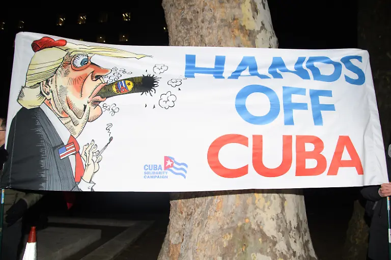 Protestors-organised-by-Stop-The-War-Coalition-stage-an-emergency-protest-over-military-intervention-by-the-US-in-Venezuela-after-capturing-and-deposing-its-leader-President-Nicolas-Maduro-in-Regent-Street-in-London-England-UK-on-Monday-5-January-2026-as-they-march-to-Parliament-Square