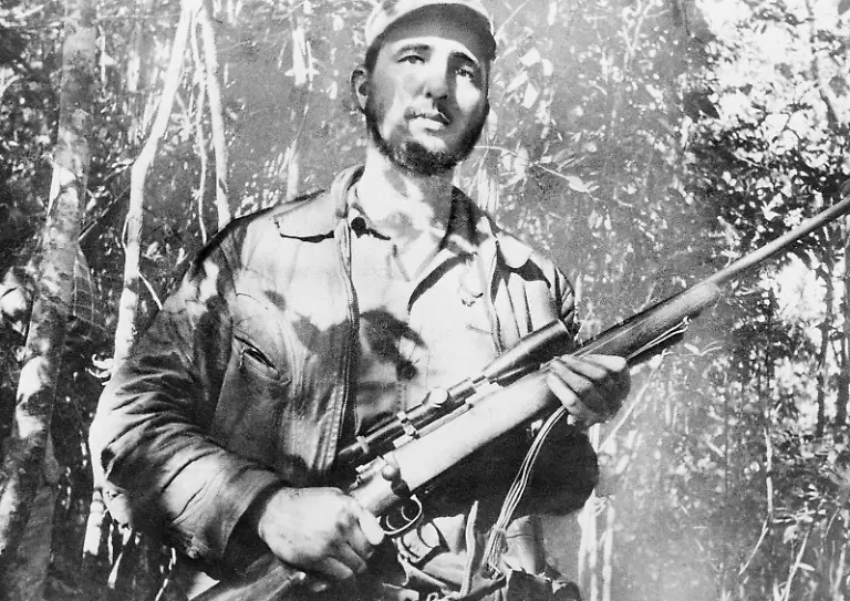 Fidel-Castro-leader-of-a-continuing-revolt-against-president-Fulgencio-Batista-and-his-regime-on-Sept-10-1957-takes-time-to-do-some-evading-at-his-mountain-hideout-in-eastern-Cuba-AP-Photo-Andrew-St