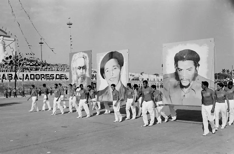 Cuban-athletes-carry-huge-portraits-of-Karl-Marx-left-Raul-Castro-center-and-Ernest-Che-Guevara-during-May-Day-parade-in-Havana-May-1-1961