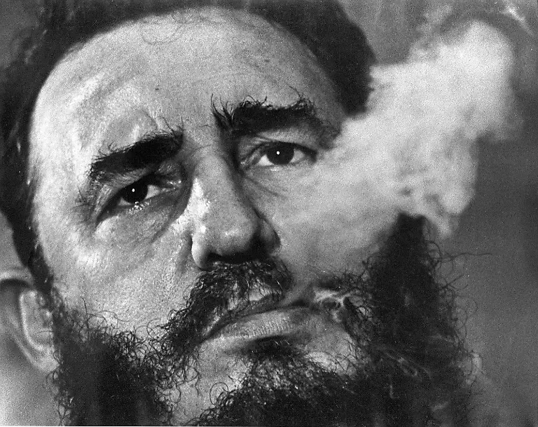 Cuban-Prime-Minister-Fidel-Castro-exhales-cigar-smoke-during-a-March-1985-interview-at-his-presidential-palace-in-Havana-Castro-a-Havana-attorney-who-fought-for-the-poor-overthrew-dictator-Fulgencio-Batista-s-government-on-Jan-1-1959-He-defeated-a-U-S-attempt-known-as-The-Bay-of-Pigs-invasion-to-overthrow-his-revolutionary-regime-on-April-19-1961-Afterwards-Cuba-armed-itself-with-Soviet-nuclear-missiles-aimed-at-the-United-States-which-almost-brought-the-world-to-the-brink-of-nuclear-disaster-Castro-s-communist-regime-still-exists-in-Cuba-90-miles-from-the-U-S-at-the-close-of-the-20th-century