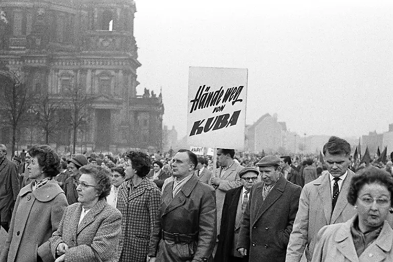 Thousands-of-East-Berliners-demonstrated-near-East-Berlinas-Humbold-University-against-the-U-S-arms-blockade-of-Cuba-in-Berlin-on-Oct-25-1962-Marching-crowd-with-sign-reading-aHands-off-Cuba