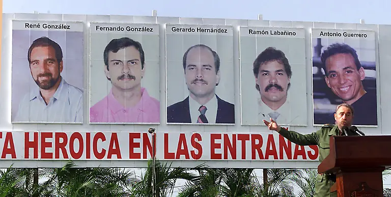 Cuban-President-Fidel-Castro-delivers-a-speech-in-front-of-the-5-portraits-of-the-Cuban-s-convicted-of-espionage-in-Miami-Saturday-June-23-2001-during-a-rally-in-Cotorro-near-Havana-Cuba-From-left-to-right-are-Rene-Gonzalez-Fernando-Gonzalez-Gerardo-Hernandez-Ramon-Labanino-and-Antonio-Guerrero-Reminiscent-of-the-campaign-Castro-s-government-launched-last-year-to-demand-repatriation-of-Cuban-boy-Elian-Gonzalez-a-new-battle-is-under-way-to-underscore-the-case-of-five-Cuban-agents-recently-convicted-in-the-United-States-on-espionage-charges