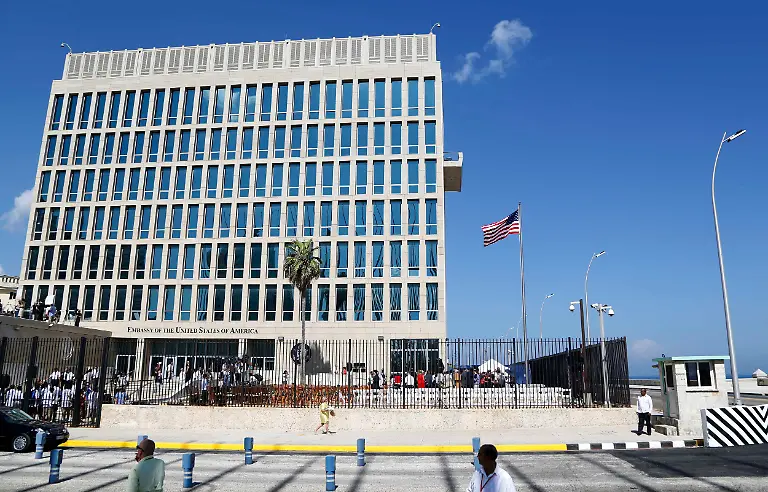 FILE-In-this-Aug-14-2015-file-photo-a-U-S-flag-flies-at-the-U-S-embassy-in-Havana-Cuba-The-United-States-is-renewing-calls-for-the-Cuban-government-to-determine-the-source-of-attacks-on-U-S-diplomats-in-Cuba-that-have-affected-some-two-dozen-people-At-a-senior-level-meeting-with-Cuban-officials-in-Washington-on-June-14-2018-the-State-Department-said-it-had-again-raised-the-issue-which-has-prompted-a-significant-reduction-in-staffing-at-the-U-S-Embassy-in-Havana