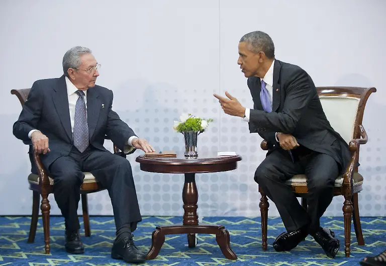US-President-Barack-Obama-right-leans-over-towards-Cuban-President-Raul-Castro-during-their-meeting-at-the-Summit-of-the-Americas-in-Panama-City-Panama-Saturday-April-11-2015-The-leaders-of-the-United-States-and-Cuba-held-their-first-formal-meeting-in-more-than-half-a-century-on-Saturday-clearing-the-way-for-a-normalization-of-relations-that-had-seemed-unthinkable-to-both-Cubans-and-Americans-for-generations