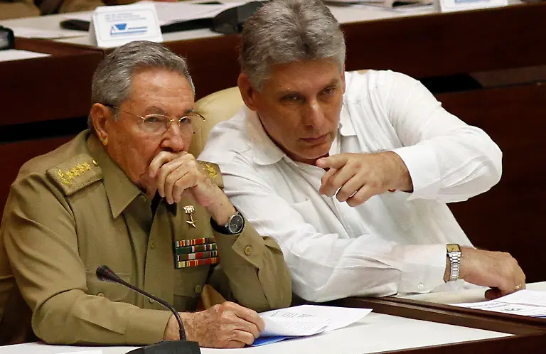 FILE-In-this-July-6-2013-file-photo-Cuba-s-President-Raul-Castro-left-and-Vice-President-Miguel-Diaz-Canel-Bermudez-attend-the-opening-of-a-two-day-twice-annual-legislative-sessions-at-the-National-Assembly-in-Havana-Cuba-Diaz-Canel-57-is-widely-expected-to-take-Castro-s-place-as-Cuba-s-next-president-on-April-19