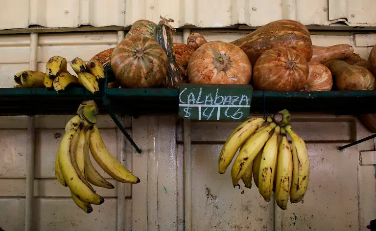 Plantains-and-squash-are-displayed-for-sale-at-a-market-stall-in-Havana-Cuba-Wednesday-July-31-2019-The-Cuban-government-is-capping-prices-for-food-and-beverages-throughout-the-country-in-order-to-control-the-risk-of-inflation-due-to-a-state-wage-hike-and-stagnant-productivity