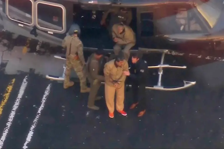 This-image-taken-video-shows-Venezuelan-President-Nicolas-Maduro-getting-off-a-helicopter-on-his-way-to-Manhattan-Federal-Court-Monday-Jan-5-2026-in-New-York