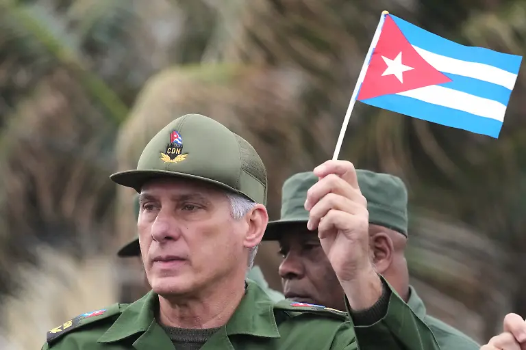 Cuban-President-Miguel-Diaz-Canel-marches-during-a-rally-to-protest-the-killing-of-Cuban-officers-during-the-U-S-operation-in-Venezuela-that-captured-Venezuelan-President-Nicolas-Maduro-outside-the-U-S-Embassy-in-Havana-Cuba-Friday-Jan-16-2026