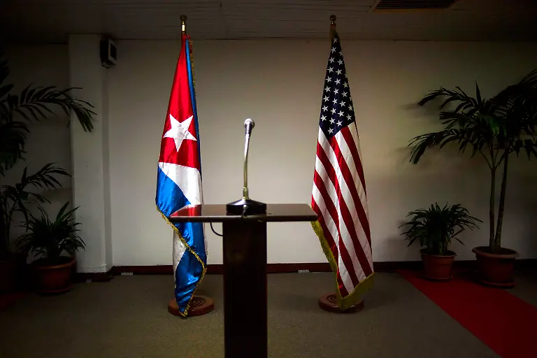 FILE-In-this-Jan-22-2015-file-photo-a-Cuban-and-U-S-flag-stand-before-the-start-of-a-press-conference-on-the-sidelines-of-talks-between-the-two-nations-in-Havana-Cuba-Half-a-year-after-the-Dec-17-2014-announcement-the-two-countries-were-yet-to-announce-what-observers-called-an-imminent-deal-on-opening-embassies-in-each-others-capitals