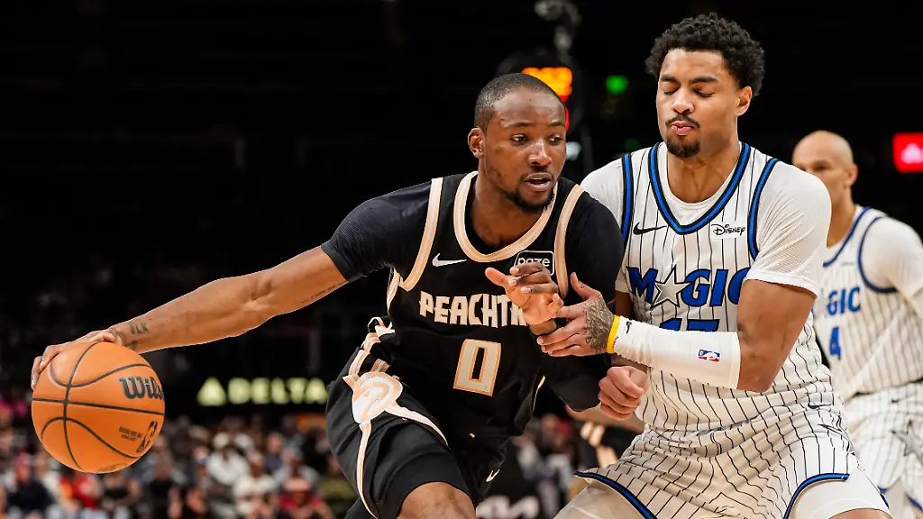 Mar-16-2026-Atlanta-Georgia-USA-Atlanta-Hawks-forward-Jonathan-Kuminga-0-dribbles-against-Orlando-Magic-guard-Jett-Howard-13-during-the-second-half-at-State-Farm-Arena