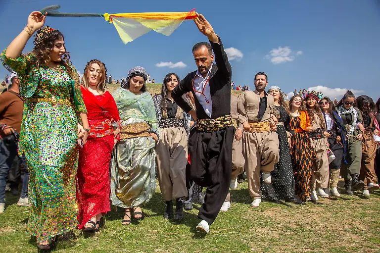 April-1-2025-Kurdistan-Kurdistan-Iran-People-in-KURDISTAN-Iran-gather-in-villages-and-mountains-to-celebrate-Nowruz-the-Kurdish-New-Year-festival-that-dates-back-more-than-6-000-years-Wearing-colorful-traditional-clothes-men-and-women-of-all-ages-dance-sing-share-food-and-light-fires-as-symbols-of-spring-renewal-and-freedom-Across-Kurdistan-thousands-come-together-to-keep-alive-this-cultural-heritage-Women-and-men-play-equal-roles-in-the-celebration-passing-traditions-across-generations-Nowruz-in-Kurdistan-is-not-only-a-holiday-but-also-a-symbol-of-identity-resilience-and-the-deep-connection-between-people-nature-and-history