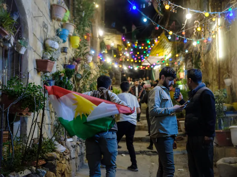 Families-gather-in-a-decorated-street-during-Nowruz-celebrations-in-Akre-in-the-Kurdistan-Region-of-Iraq-on-March-20-2025-Akre-is-widely-regarded-as-the-capital-of-Nowruz-festivities-in-the-region-Nowruz-also-spelled-Newroz-is-an-ancient-Persian-festival-marking-the-arrival-of-spring-and-the-new-year-traditionally-observed-on-March-20-or-21-the-vernal-equinox