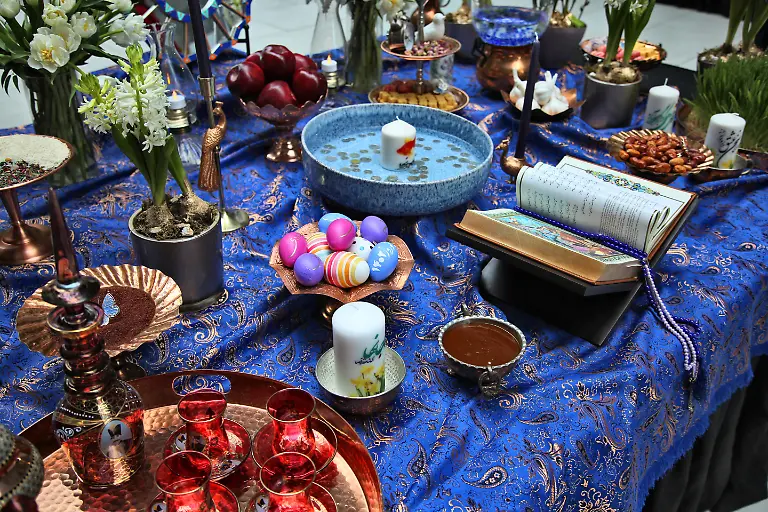 Traditional-items-adorn-a-Haft-Sin-Haft-Seen-an-arrangement-of-seven-symbolic-items-that-all-begin-with-the-letter-S-in-Farsi-during-Nevruz-celebrations-in-Toronto-Canada-on-March-18-2023-Nevruz-Norooz-Nourooz-Newroz-Nowruz-which-means-new-day-marks-the-first-day-of-Spring-and-is-also-celebrated-in-Iran-Afghanistan-Azerbaijan-Albania-Bashkortostan-Bahrain-Georgia-Turkmenistan-Tajikistan-Uzbekistan-Kyrgyzstan-and-Kazakhstan-as-well-as-among-various-other-Iranian-and-Turkic-peoples-in-Iraqi-Kurdistan-Syria-Lebanon-Pakistan-India-northwestern-China-the-Caucasus-the-Crimea-and-the-Balkans-Photo-by-Creative-Touch-Imaging-Ltd