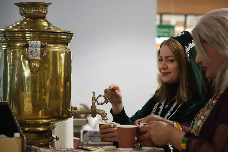 Iranian-women-serve-tea-from-a-traditional-samovar-during-Nevruz-celebrations-in-Toronto-Canada-on-March-18-2023-Nevruz-Norooz-Nourooz-Newroz-Nowruz-which-means-new-day-marks-the-first-day-of-Spring-and-is-also-celebrated-in-Iran-Afghanistan-Azerbaijan-Albania-Bashkortostan-Bahrain-Georgia-Turkmenistan-Tajikistan-Uzbekistan-Kyrgyzstan-and-Kazakhstan-as-well-as-among-various-other-Iranian-and-Turkic-peoples-in-Iraqi-Kurdistan-Syria-Lebanon-Pakistan-India-northwestern-China-the-Caucasus-the-Crimea-and-the-Balkans-Photo-by-Creative-Touch-Imaging-Ltd