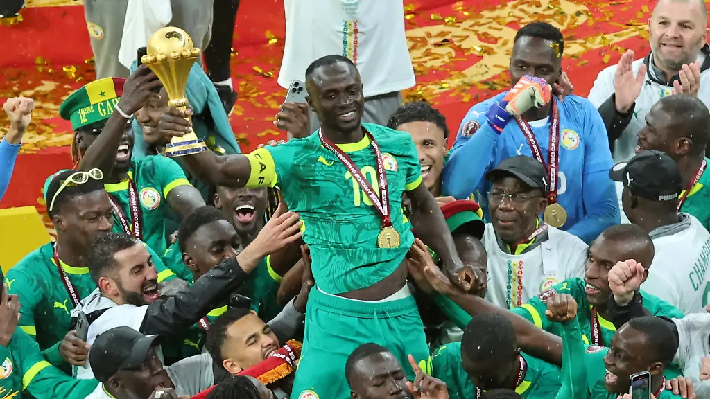 FILE-Senegal-s-Sadio-Mane-holds-the-trophy-aloft-as-he-celebrates-with-teammates-after-winning-the-Africa-Cup-of-Nations-final-soccer-match-between-Senegal-and-Morocco-in-Rabat-Morocco-Sunday-Jan-18-2026