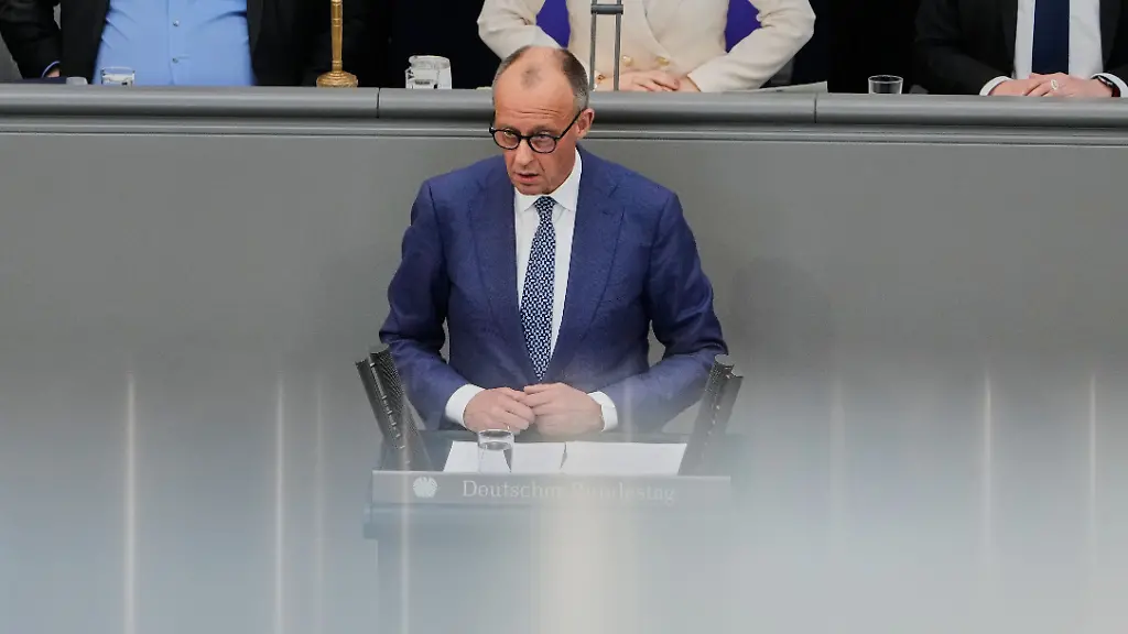 German-Chancellor-Friedrich-Merz-delivers-a-statement-during-a-session-of-the-German-parliament-in-Berlin-Germany-Wednesday-March-18-2026