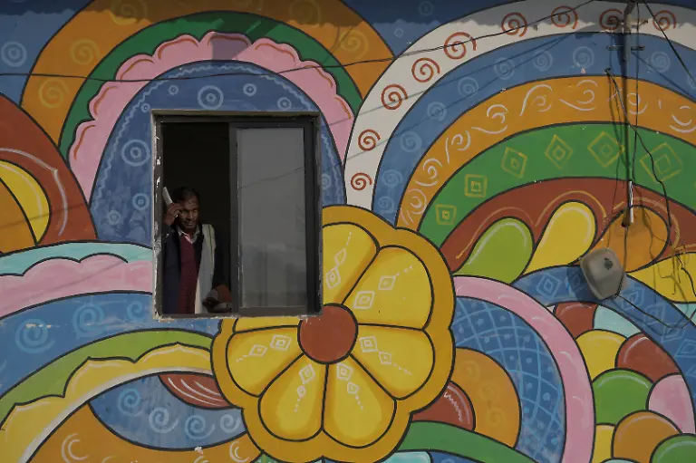 Security-guard-Pannelal-Rajak-78-prepares-to-leave-in-the-morning-after-his-night-shift-at-Kenapara-Eco-Park-which-was-developed-from-a-closed-open-cast-coal-mine-pit-into-a-small-tourist-hub-in-Surajpur-India-November-18-2025-Decades-ago-Rajak-gave-up-his-land-for-the-Bishrampur-open-cast-coal-mine-in-exchange-for-money-and-a-job-in-the-mine-he-believed-would-follow-but-he-never-got-the-job-Today-he-guards-the-same-mine-At-least-I-am-earning-something-here-now-he-says-REUTERS-Avijit-Ghosh-SEARCH-INDIA-GHOSH-COAL-FOR-THIS-STORY-SEARCH-WIDER-IMAGE-FOR-ALL-STORIES
